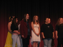 Travis singing Oklahoma! with his fellow Musical Theatre Class students.