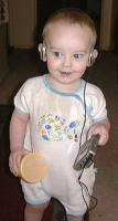 Nicolas listening to Christmas music