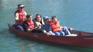 Daniel, Travis, Chris and Nicolas getting a ride around the lake 