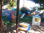 East side of the yard.  We have slides, playhouse, climbing area, sand box, pond with fish (fenced off of course, but the childr