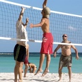 Eric (in black shorts) goes up to block the spike