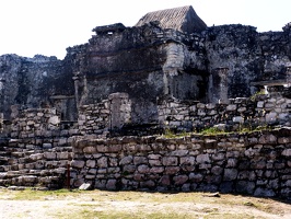 Ruins.  The thatched roof there is to protect some fragile part of the structure.