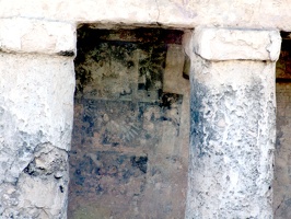 The walls were covered with paintings.  You can see remnants of the blue, black, and red on this protected wall.