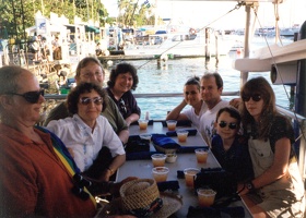 Family in Hawaii with lots of POG.  Mark, Jeannette, Scott, Nessa, Julie, Eric, Travis, Amy, and (presumably) Chris behind the c