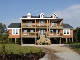    Beach home raised up in case of flooding.