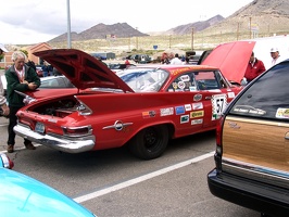 Car show the day before the race.  Please add comments to identify the cars and/or owners.