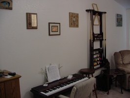 Living room wall with pool wall stand and piano.