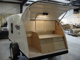 The kitchen of a finished trailer without any appliances.