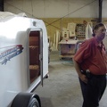 Mike Quinlan and the trailer with the shop in the background.