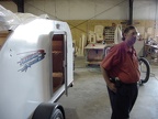 Mike Quinlan and the trailer with the shop in the background.