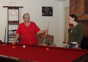 Joannie and Christina studying the table intently.