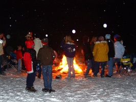 Unknown people at the bonfire