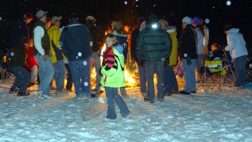 Unknown people at the bonfire